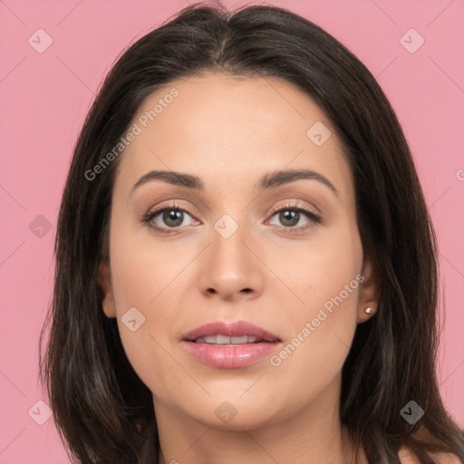 Joyful white young-adult female with long  brown hair and brown eyes