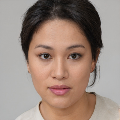 Joyful white young-adult female with medium  brown hair and brown eyes