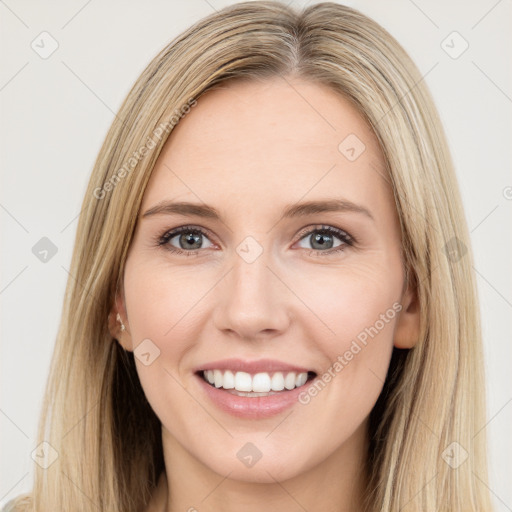 Joyful white young-adult female with long  brown hair and green eyes