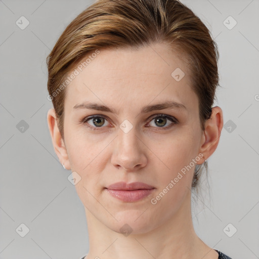 Joyful white young-adult female with short  brown hair and grey eyes