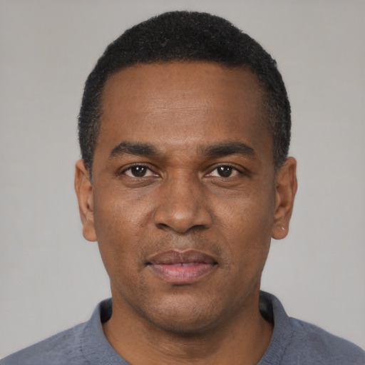 Neutral black adult male with short  black hair and brown eyes