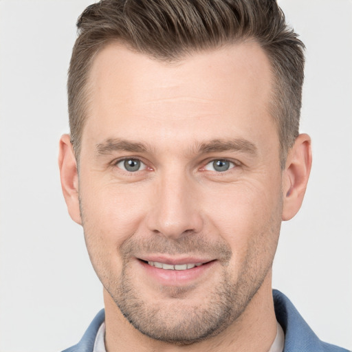 Joyful white young-adult male with short  brown hair and brown eyes