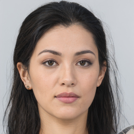 Joyful asian young-adult female with long  brown hair and brown eyes