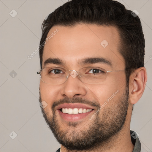 Joyful white young-adult male with short  brown hair and brown eyes