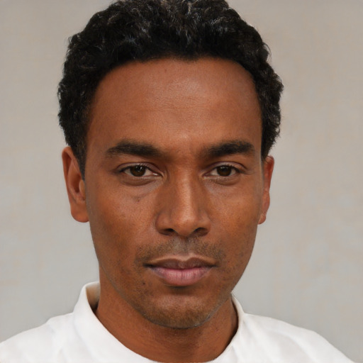Neutral black young-adult male with short  black hair and brown eyes