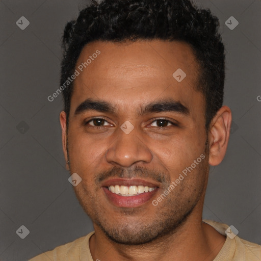 Joyful black young-adult male with short  brown hair and brown eyes