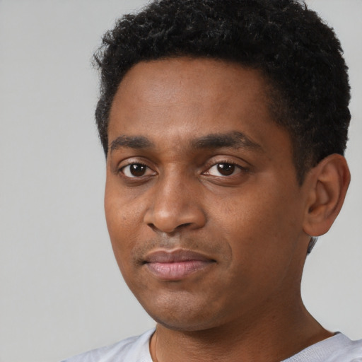 Neutral black young-adult male with short  black hair and brown eyes