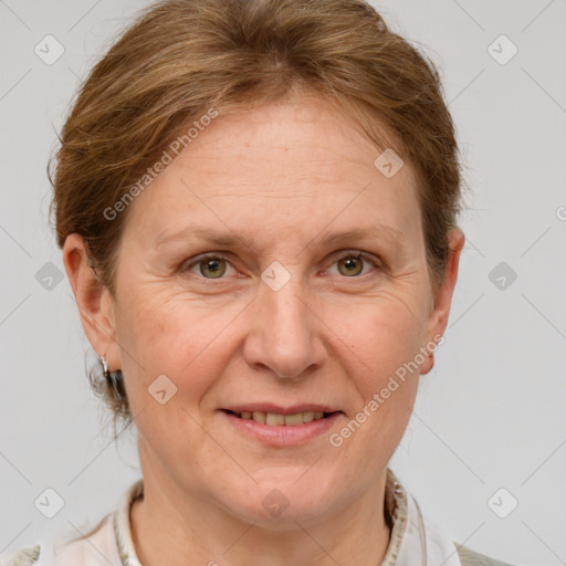 Joyful white adult female with short  brown hair and grey eyes