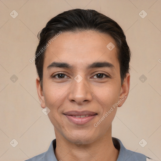 Joyful white young-adult male with short  black hair and brown eyes