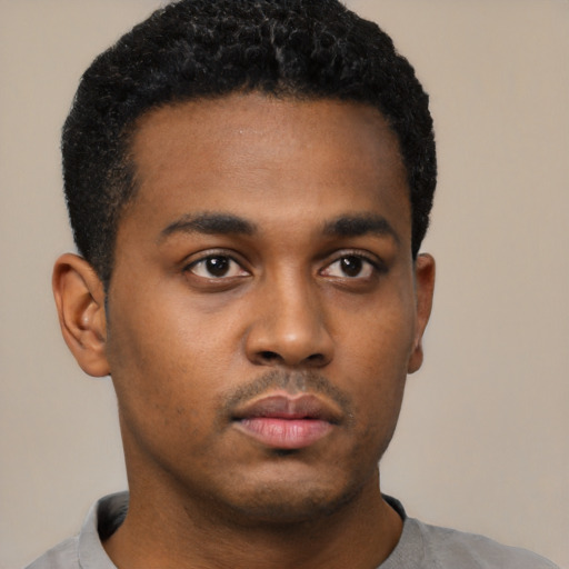 Neutral black young-adult male with short  black hair and brown eyes