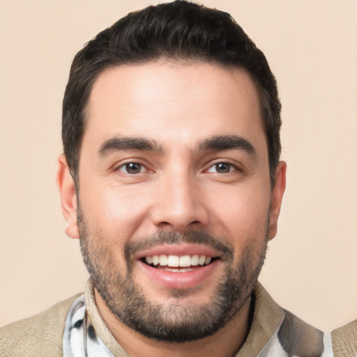 Joyful white young-adult male with short  black hair and brown eyes