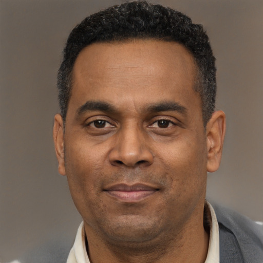 Neutral latino adult male with short  black hair and brown eyes