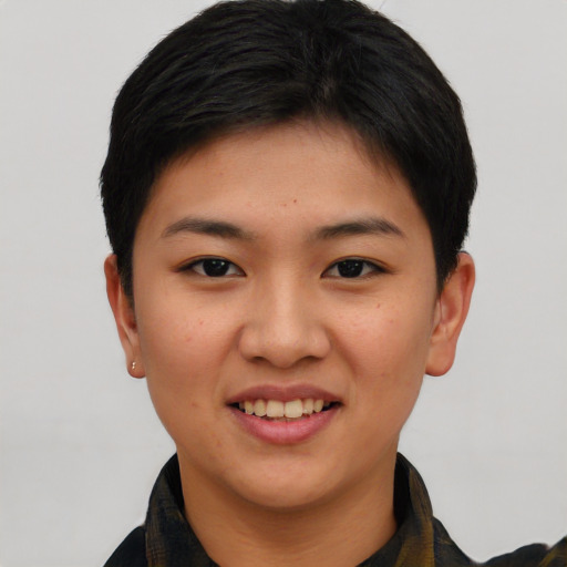 Joyful asian young-adult female with short  brown hair and brown eyes