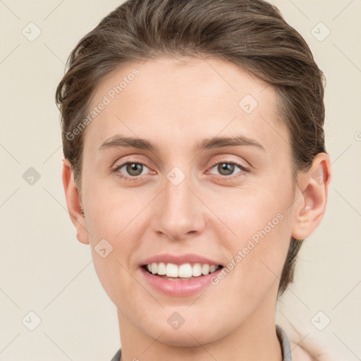 Joyful white young-adult female with medium  brown hair and grey eyes