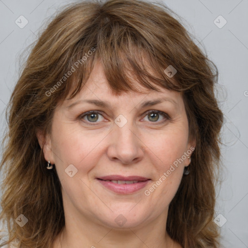 Joyful white adult female with medium  brown hair and grey eyes