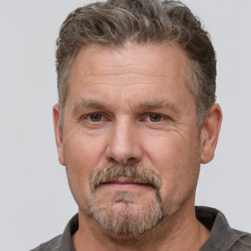 Neutral white middle-aged male with short  brown hair and brown eyes