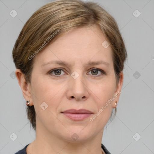 Joyful white adult female with medium  brown hair and grey eyes