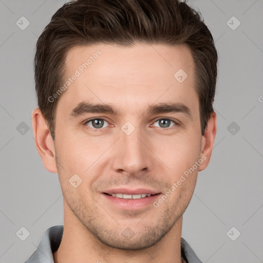 Joyful white young-adult male with short  brown hair and grey eyes