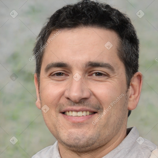 Joyful white adult male with short  black hair and brown eyes