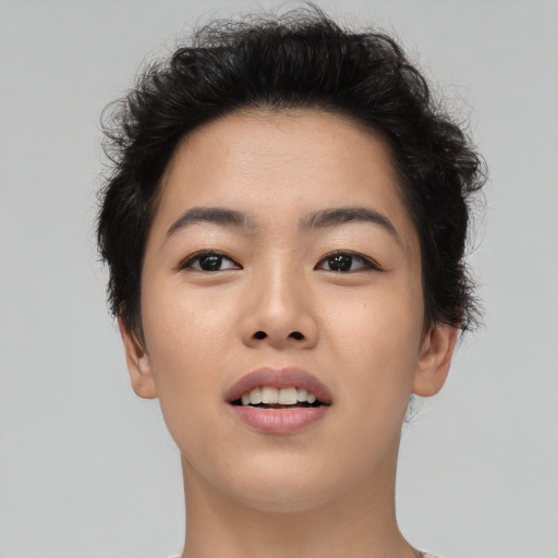 Joyful asian young-adult female with short  brown hair and brown eyes