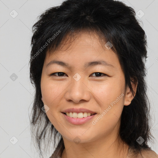 Joyful asian young-adult female with long  brown hair and brown eyes