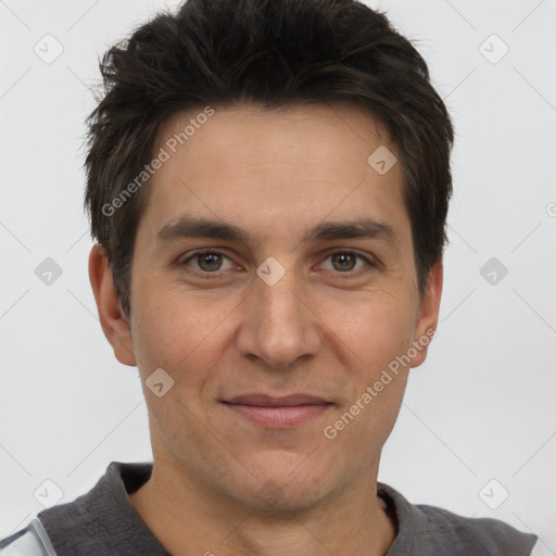 Joyful white adult male with short  brown hair and brown eyes