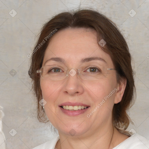 Joyful white adult female with medium  brown hair and brown eyes