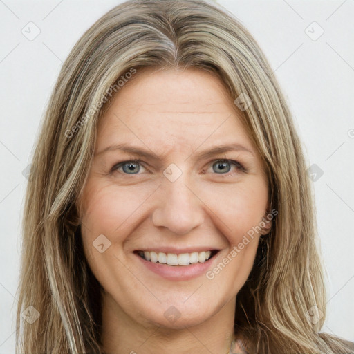 Joyful white young-adult female with long  brown hair and green eyes