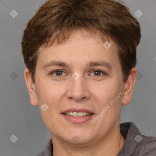 Joyful white adult male with short  brown hair and grey eyes