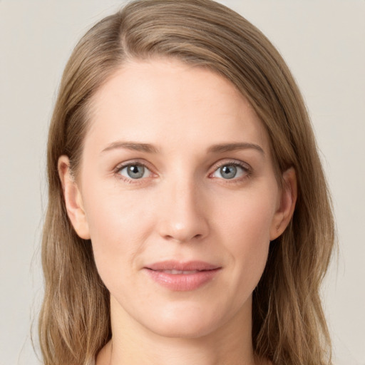 Joyful white young-adult female with long  brown hair and blue eyes