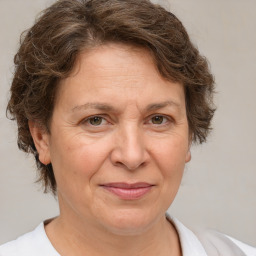 Joyful white adult female with short  brown hair and brown eyes