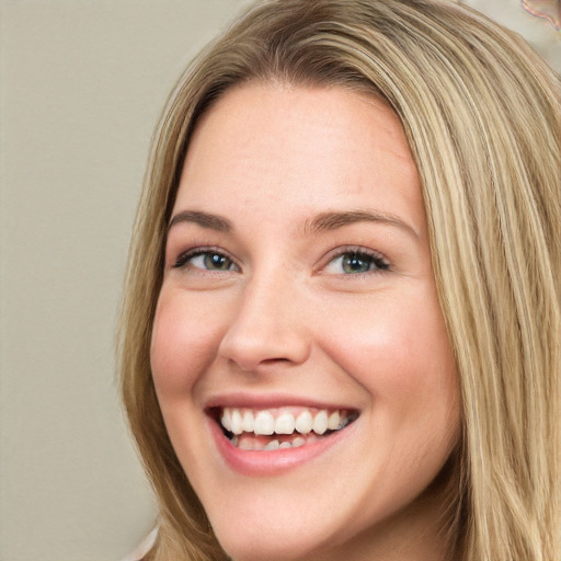 Joyful white young-adult female with long  brown hair and green eyes