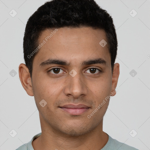 Joyful latino young-adult male with short  brown hair and brown eyes