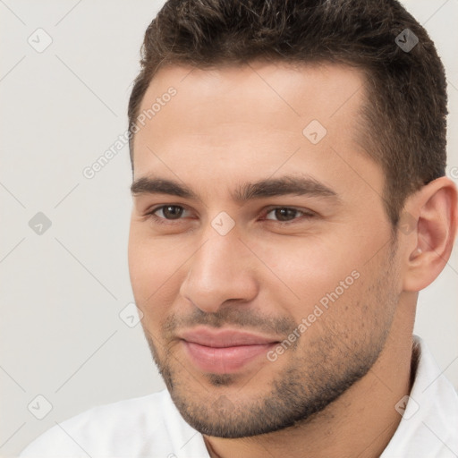 Joyful white young-adult male with short  brown hair and brown eyes