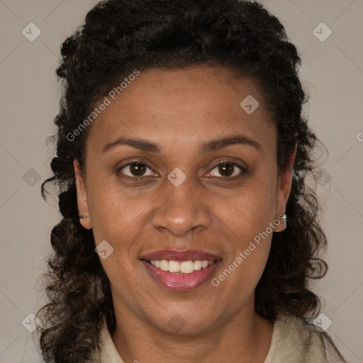 Joyful black young-adult female with long  brown hair and brown eyes