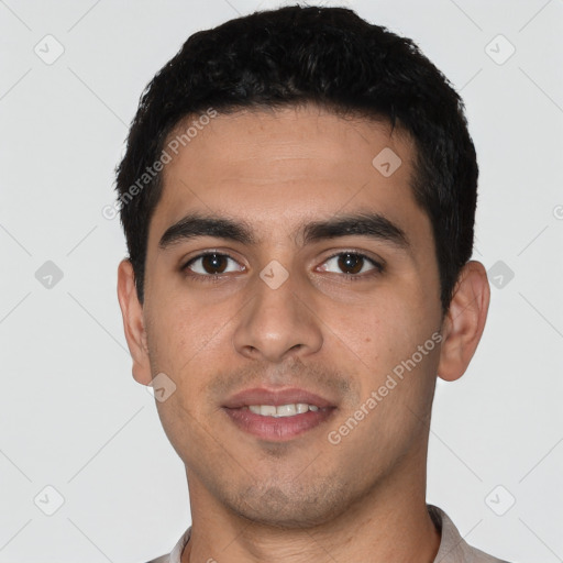 Joyful white young-adult male with short  black hair and brown eyes