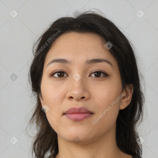 Joyful latino young-adult female with medium  brown hair and brown eyes