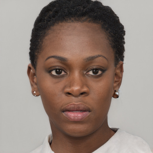 Neutral black young-adult female with short  brown hair and brown eyes