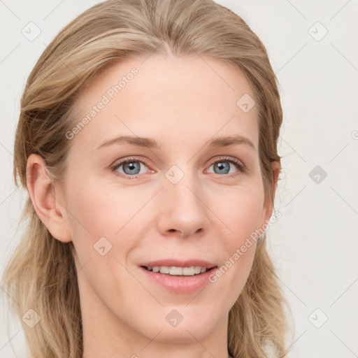 Joyful white young-adult female with long  brown hair and blue eyes