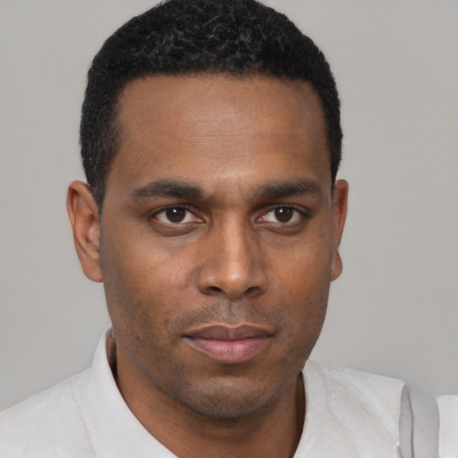 Neutral black young-adult male with short  black hair and brown eyes