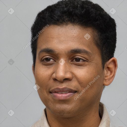 Joyful latino young-adult male with short  black hair and brown eyes