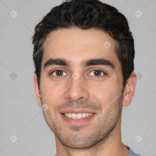 Joyful white young-adult male with short  black hair and brown eyes