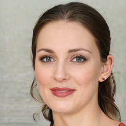 Joyful white young-adult female with medium  brown hair and blue eyes