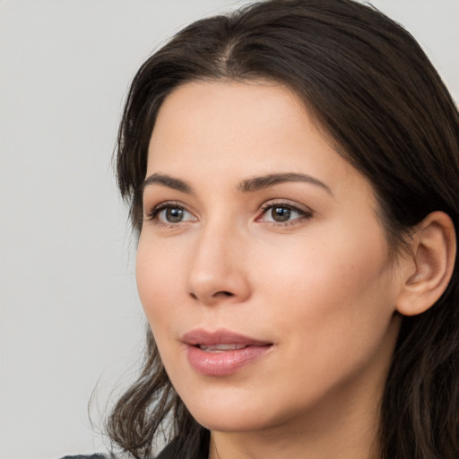 Neutral white young-adult female with medium  brown hair and brown eyes