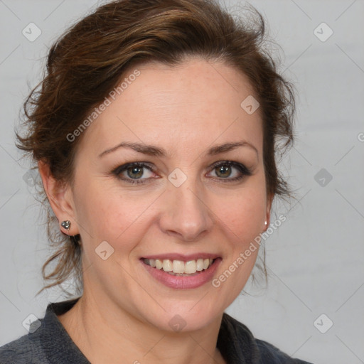 Joyful white adult female with medium  brown hair and blue eyes