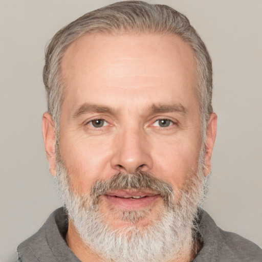 Neutral white middle-aged male with short  gray hair and brown eyes