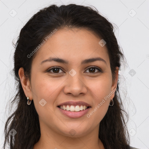 Joyful latino young-adult female with long  brown hair and brown eyes