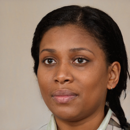 Neutral black young-adult female with medium  brown hair and brown eyes
