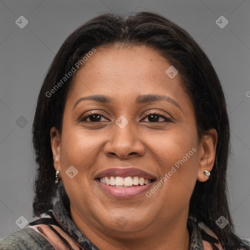 Joyful black adult female with medium  brown hair and brown eyes