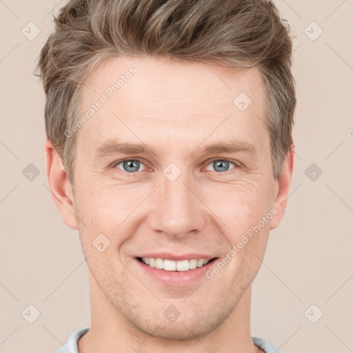 Joyful white adult male with short  brown hair and grey eyes